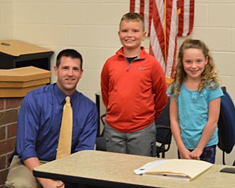 Lincolnview second-grade teacher Dan Williamson with two of this students, Evan and Kailyn. (Kelsey Clemons/Van Wert independent)
