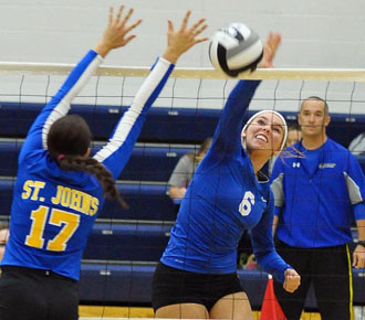 Lancer Ashley Teman (6) slams one over the net against Delphos St. John's during a match held Tuesday at Lincolnview. The Lady Blue Jays won the match in four games. (Jan Dunlap/Van Wert independent)
