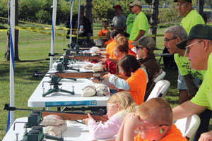 Youngsters shoot during an earlier Youth Day event. (submitted photo)