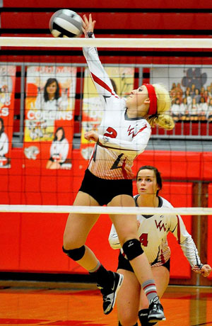 Emma Kohn (2) smashes one over the net for Van Wert, while teammate Amanda Coplin (8) looks on. The Cougars fell to Bath in four games. (Jan Dunlap/Van Wert independent)