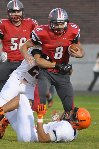 Cougar quarterback Colin Smith (8) looks for daylight during Friday's Homecoming contest against Elida. (Jan Dunlap/Van Wert independent)