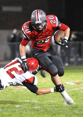 Justice Tussing (20) breaks a tackle on the way to a touchdown during Friday's game against Shawnee. (Jan Dunlap/Van Wert independent)