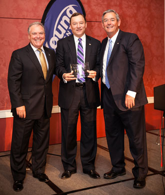 Pictured are Central Senior Vice President/Secretary Edd Buhl (left) and President/Chairman of the Board Bill Purmort (right) accepting the Best Practices Award from Bob Rusbuldt, Big "I" president/CEO. (photo submitted)