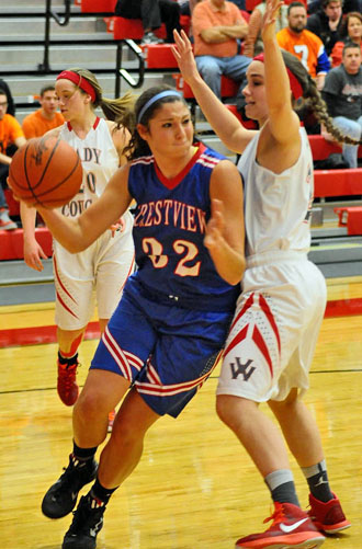 Crestview's Emily Bauer (32) tries to muscle her way around Cougar Erin Morrow (24) during Friday night's McDonald's Tip-Off Classic Tournament. The Knights won 45-19. (Jan Dunlap/Van Wert independent)