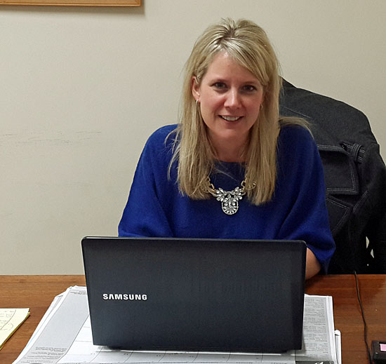 Delphos resident Sue Gerker sits at her desk in the Van Wert County commissioners' office. (photo submitted)