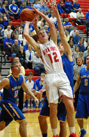 Cougar Josh Braun (12) puts up a layup against Delphos St. John's on Tuesday. The Blue Jays edged Van Wert 50-47 in the non-conference game. (Jan Dunlap/Van Wert independent)