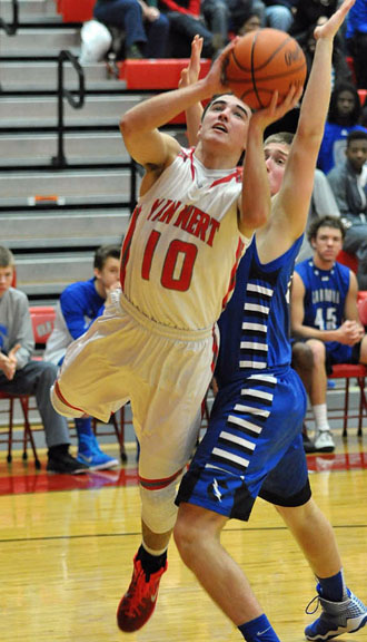 Van Wert's Colin Smith (10) drives around a Fort Wayne Carroll defender for a layup during Tuesday's non-conference game won by Carroll. (Jan Dunlap/Van Wert independent)