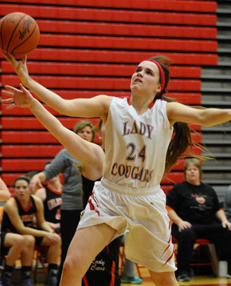 Van Wert's Erin Morrow (24) drives in for a layup against Coldwater on Monday night. (Jan Dunlap/Van Wert independent)