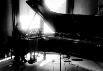 Radoslav Lorković, international blues musician, at his grand piano. Lorković will be performing at the Wassenberg Art Center on Jan. 24 at 7 p.m. Admission is free and coincides with the opening reception of the American Watercolor Exhibition.  (Photo submitted.)