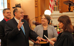 Ohio Representative Tony Burkley (second from left) is sworn in to a second term on Monday, (Ohio House photo)