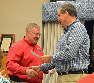 Crestview Superintendent Mike Estes (left) presents Board member Lonnie Nedderman with a certificate honoring his board service during Monday's meeting. Board members are typically honored during January. (Kelsey Clemons/Van Wert independent)