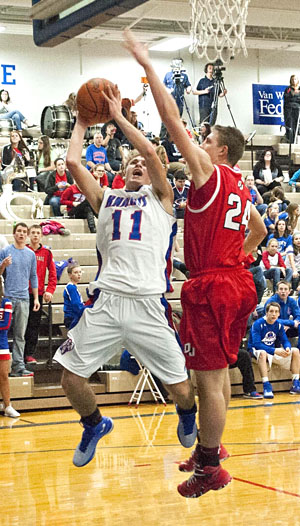 Crestview's Connor Lautzenheiser (11) goes in for a layup against Delphos Jefferson. The Knights edged the Wildcats 56-52 in the NWC contest. (Bob Barnes/Van Wert independent)