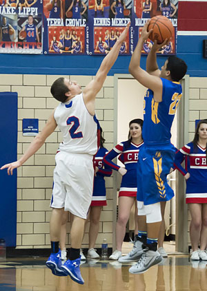 Lincolnview's Justis Dowdy (22) shoots over Crestview's Preston Zaleski (2) during a NWC contest won by the Knights, 49-38. (Bob Barnes/Van Wert independent)
