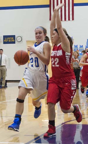 Lancer Alana Williams (20) drives the lane on a Bluffton defender during Lincolnview's 51-38 win over the Lady Pirates. (Bob Barnes/Van Wert independent)