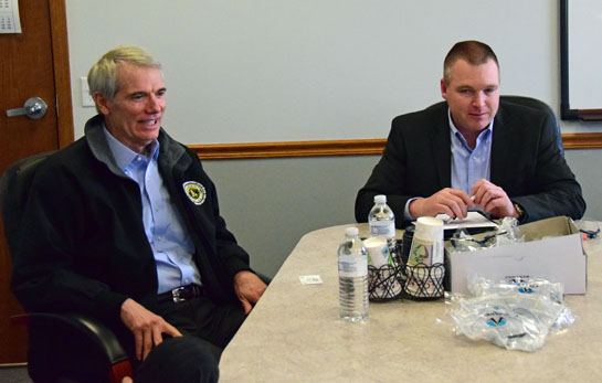 U.S. Senator Rob Portman (left) visits with Scott Braun of Braun Industries on Friday afternoon. (Dave Mosier/Van Wert independent)