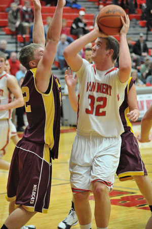 Cougar Drew Myers (32) prepares to shoot over a Kalida defender during Tuesday night's non-conference game won by Van Wert, 55-46. (Jan Dunlap/Van Wert independent)