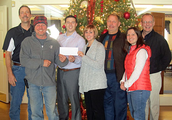 Van Wert County Foundation kicks off the YMCA Camp Clay Splash Pad campaign with a donation of $20,000. Shown are (from the left) YMCA Executive Director Hugh Kocab; Clint Myers, Camp Clay director; VWCF Executive Secretary Seth Baker; Krista Schlemmer, YMCA Executive Board; Gary Taylor, VWCF trustee/YMCA Board member; Sara Zura, Splash Pad Committee member; and Andy Czajkowski, VWCF trustee. Plans and designer drawings are available for viewing at the YMCA. (YMCA photo)