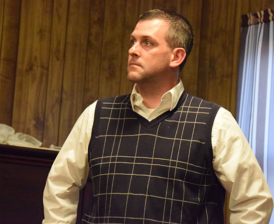 Landowner Ernie Welch listens grimly as Wetzel area residents speak out against his hog mega-farm project Monday evening. (Dave Mosier/Van Wert independent)