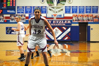 Junior forward Emily Bauer plans to defend an in-bound pass on senior night as the Lady Knights prepare for tournament. (Photo submitted.)