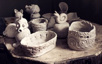 Pottery projects from the Wassenberg Art Center pottery class waiting to be fired. (Photo submitted.)