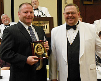 Eric McCracken (left) accepts his award from State President Roger Martin. (Elks photo)