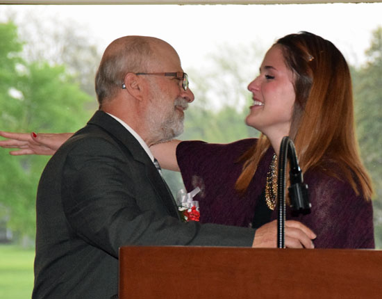 VWHS senior Becky Anderson hugs teacher Tom Brown at the Teachers Appreciation Banquet held Thursday night at Willow Bend Country Club. (Dave Mosier/Van Wert independent)
