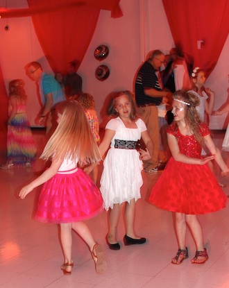 Pictured are a few of the 82 girls enjoying themselves at the Father-Daughter dance on May 3. (Photo submitted.)