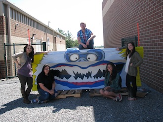 Lincolnview High School Art students participated in ODOT's "Paint the Plow" competition again this year. The snow plows will be used in local parades during the summer, and the service of next winter's snow plowing. The following students shown in the photo worked hard on their blue and yellow design this year of the abominable snow man: Lauren Leatherman, Logan Jewel, Kelsey Pavel, Michaela Campbell, and Gwen Burdette. (Photo submitted.)