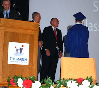 A graduate receives his diploma and is congratulated by The Marsh Foundation Trustees. (Photo submitted.)