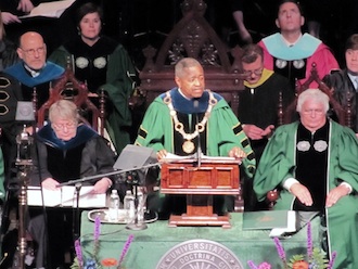 An example of low-light photography, Rex Dolby's photo of OU president Roderick McDavis was taken at Rachel Dolby's commencement from the opposite end of the Convocation Center. (Photo submitted.)