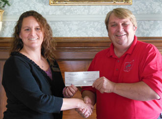 Shown are YWCA Executive Director Danielle Chiles receiving a check from Elks Exalted Ruler Alan R. Lautzenheiser. (Elks photo)