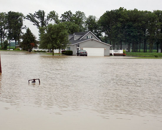 High water is seen along Ohio 49 near Convoy, (photo by Rick McCoy for the VW independent)