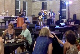 A crowd gathers to listen to the Dan Smyth Band of Fort Wayne, Ind. who performed at the 59th Annual June Art Exhibit at the Wassenberg Art Center. (Photo submitted.)