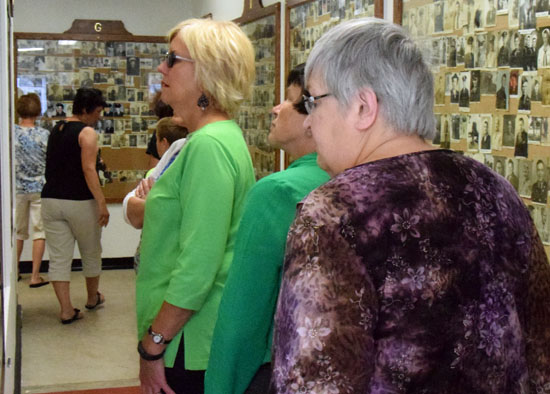 Van Wert County officials and others tour the expanded Van Wert Military Photo Album Chapel following its rededication on Wednesday. (Dave Mosier/Van Wert independent)