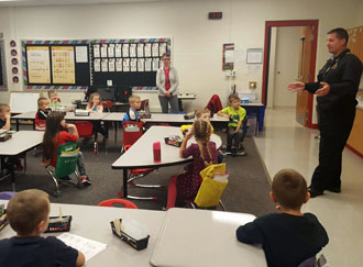 Van Wert Fire Department Captain Craig King, who is also Middle Point fire chief, is shown discussing the importance of having a functioning smoke detector to students in Amy Smith’s kindergarten class at the Van Wert Early Childhood Center. (photo submitted)