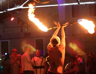 Scenes from 2014 Doctor Wassenstein’s Halloween event at the Wassenberg Art Center. Guests amused at a fire-performer.  (Photo submitted.)