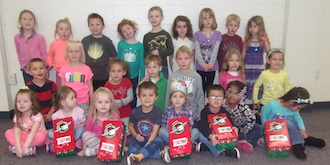 Calvary preschoolers collected spare change to help needy children. (Photo submitted.)