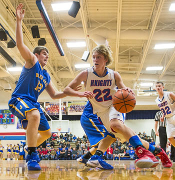 Crestview's Cody Mefferd (22) drives to the basket against a Delphos St. John's defender while teammate Spencer Rolsten (32) looks on. (Bob Barnes/Van Wert independent)