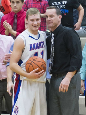 Crestview's Dylan Lautzenheiser (11) poses with Coach Jeremy Best after scoring the 1,000th point of his career. (Bob Barnes/Van Wert independent)