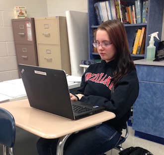 Senior Courtney George catches up on some homework during Knight Time after a long Thanksgiving break.  (Photo submitted.)
