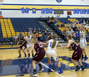 Lincolnview's Alena Looser (22) makes the winning shot from the key in Thursday's Northwest Conference contest against Paulding. (Bob Barnes/Van Wert independent)