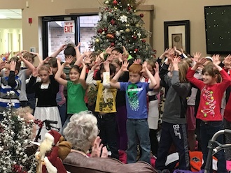 "The best way to spread Christmas cheer is singing loud for all to hear." Third graders spread Christmas cheer to audiences at Wee Care Learning Center, Van Wert Manor and Vancrest in Van Wert by singing songs, passing out candy canes and handing out Christmas cards. Lincolnview thanks these organizations for hosting the children.  (Photo submitted.)