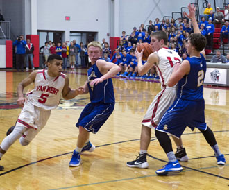 Van Wert's Josh Braun (12) looks to pass to Jacoby Kelly (5) during the Cougars' WBL match-up with St. Marys on Friday. The Roughriders edged Van Wert 83-81. (Bob Barnes/Van Wert independent)