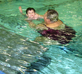 A local boy shows his “kick, kick, kicks” during a previous swim session. Registration is going on now through January 3. For more information, check out the YM website online. (YMCA photo)