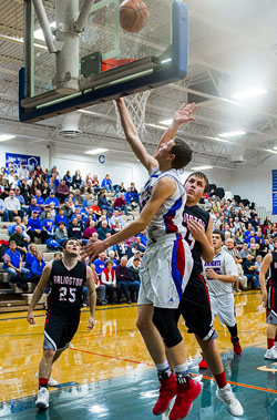 Crestview's Javin Etzler (15) puts a shot up under the basket during Saturday's game against Arlington, which the Knights won 56-47. (Bob Barnes/Van Wert independent)