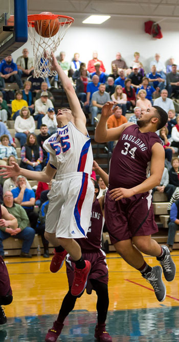 Crestview' Brant Richardson (55) puts in a layup over a Paulding defender during the Knights' 62-36 win over the Panthers. (Bob Barnes/Van Wert independent)