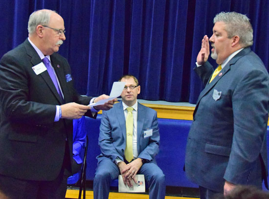 2015 Ohio School Boards Association President Ed Penrod (left) swears in Eric Germann as the new OSBA president on Saturday. (Dave Mosier/Van Wert independent)