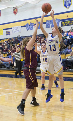 Lincolnview's Maddie Gorman (13) shoots over a Kalida defender in Tuesday's non-conference girls' basketball game. (Bob Barnes/Van Wert independent) 