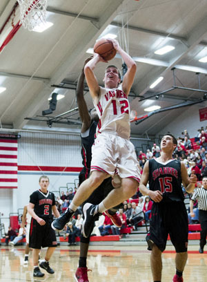 Van Wert's Josh Braun (12) goes up for a layup against Shawnee on Friday. Braun led the Cougars with 14 points, but the Indians won the game, 49-37. (Bob Barnes/Van Wert independent)