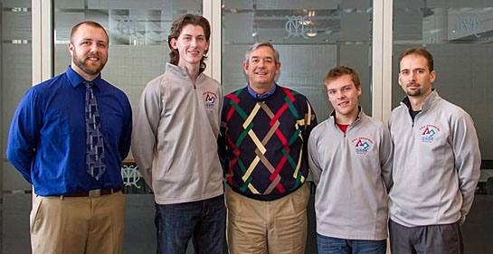 Shown are Robotics Team members Zane McElroy and Nick White, title sponsor Bill Purmort of Central Insurance, team member Spencer Teman, and Coach Bob Spath. (photo submitted)